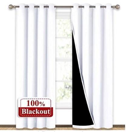 Blackout curtains covering window during day time