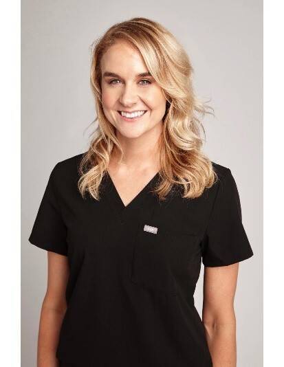 Danielle Leveck in nursing scrubs